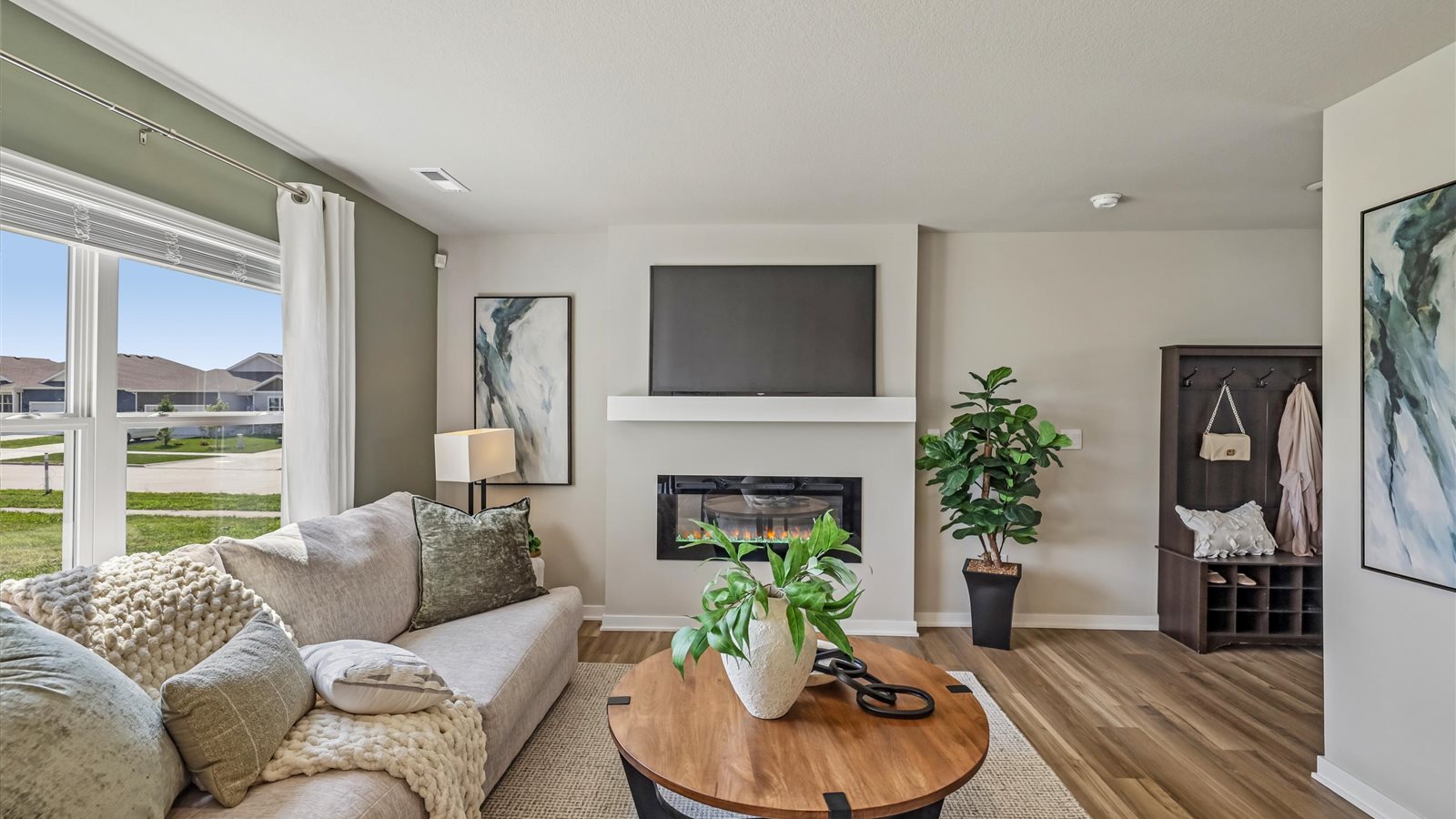 Open concept living room with electric fireplace