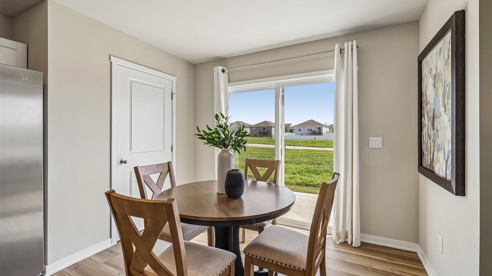 Open concept dining space with access to backyard
