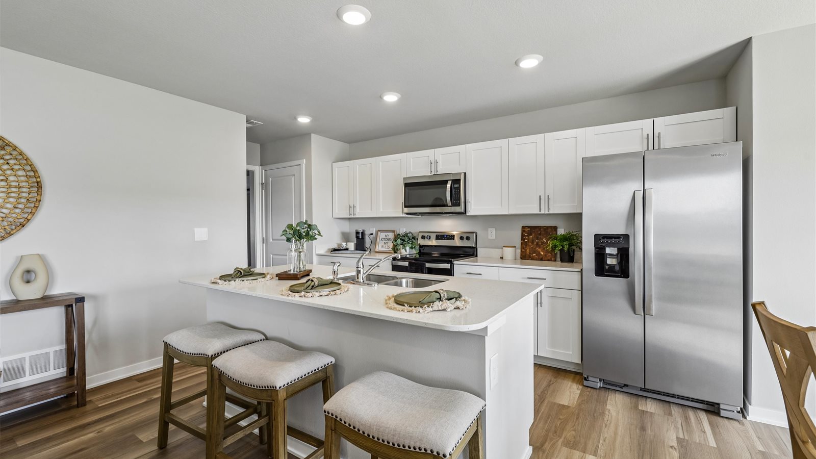 Kitchen with white cabinetry and quartz countertop