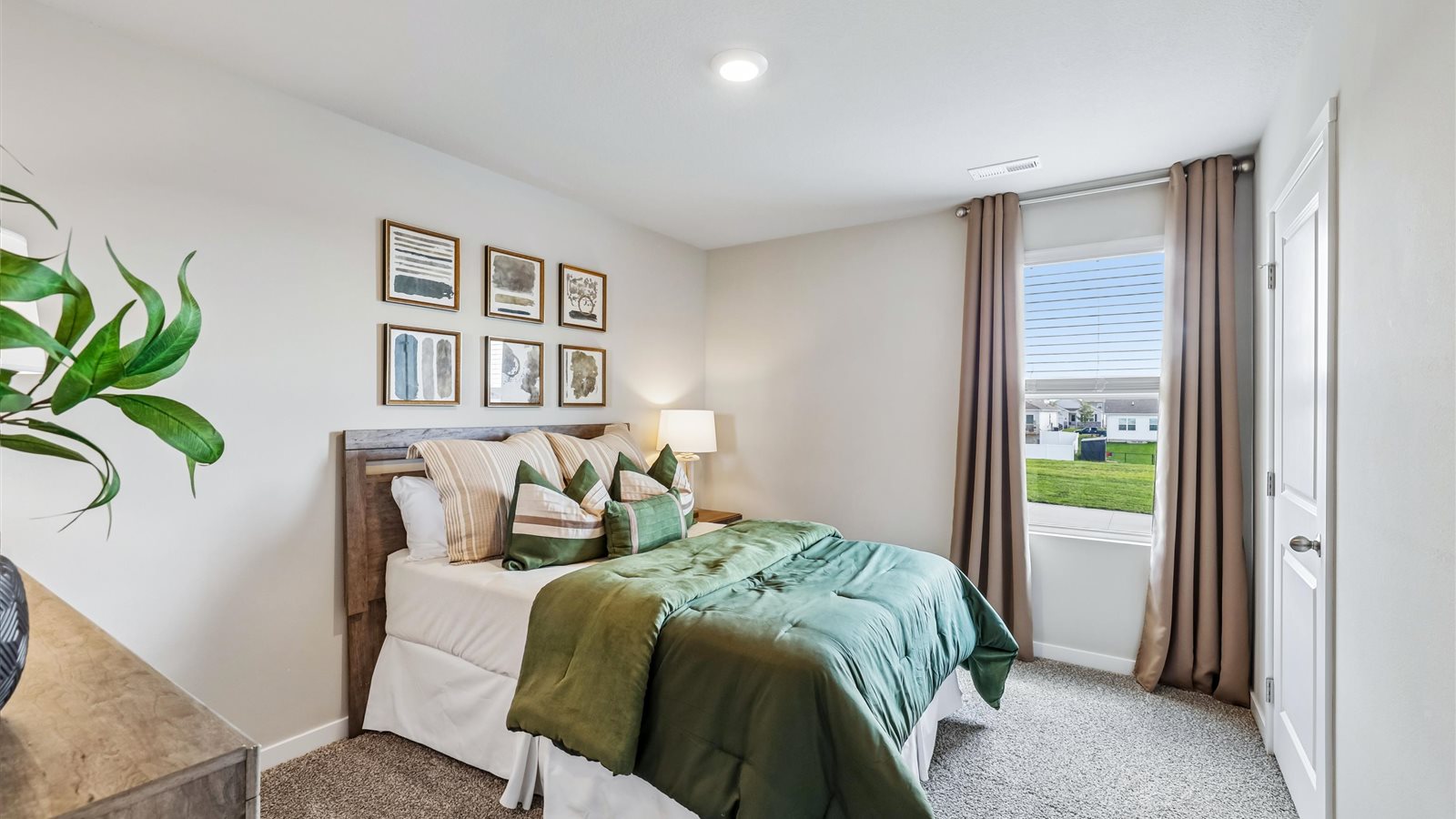 Comfortable secondary bedroom with natural light, modern finishes, and versatile living space.