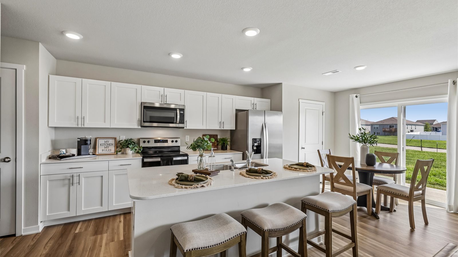 Kitchen with white cabinetry and quartz countertop