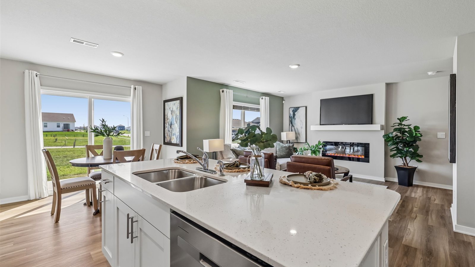 Kitchen with white cabinetry and quartz countertop