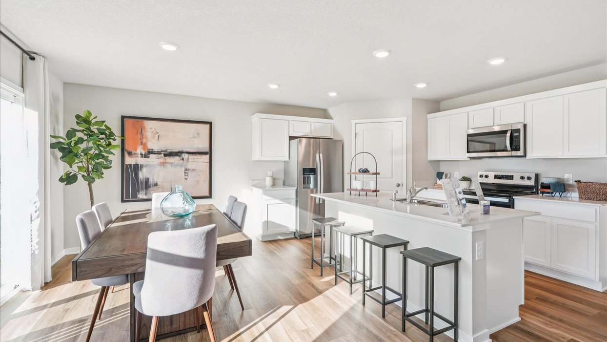 Open concept dining space with access to backyard