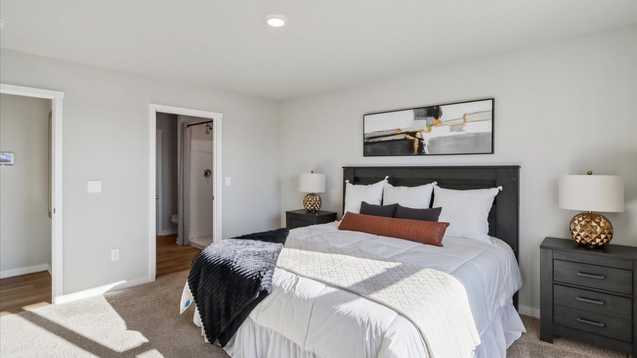 Primary bedroom with natural lighting and spacious layout