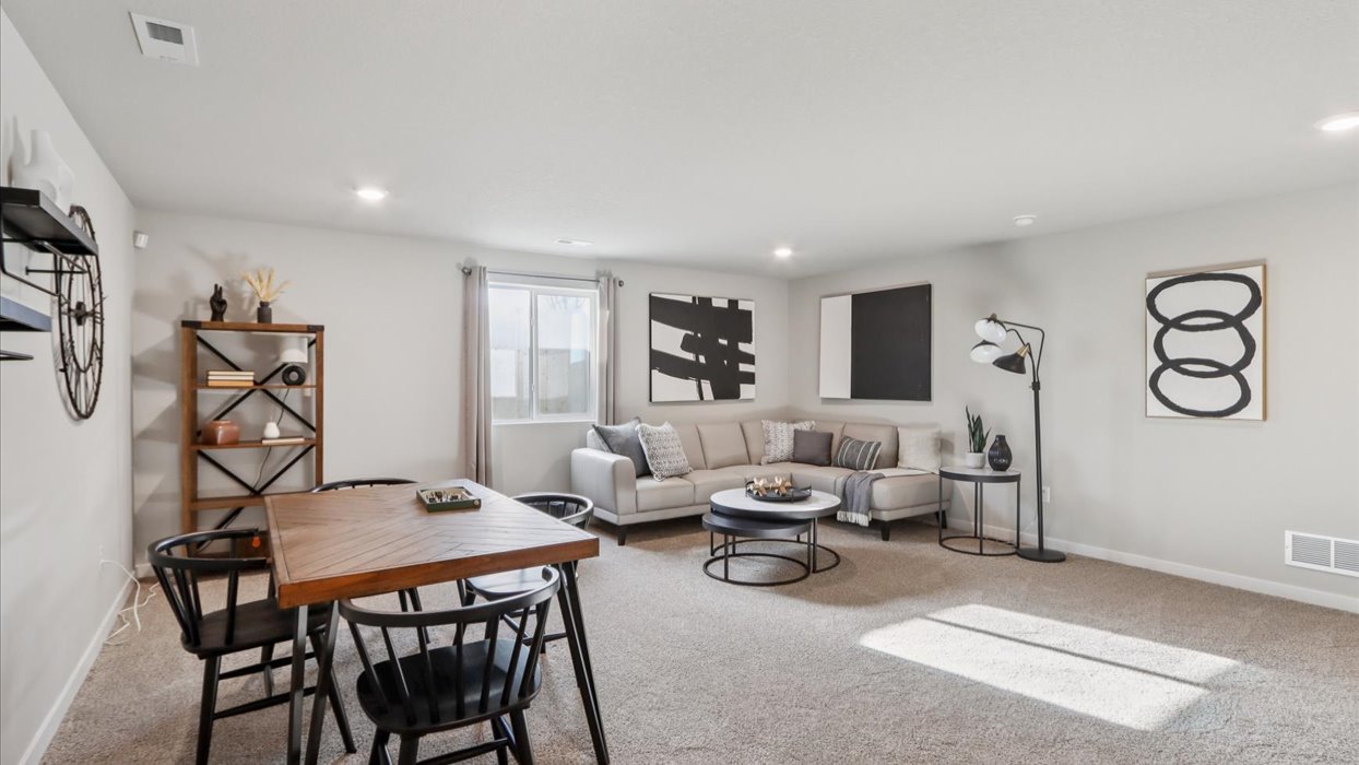 Finished basement living area with comfortable seating space and flexible room for entertaining or relaxing.