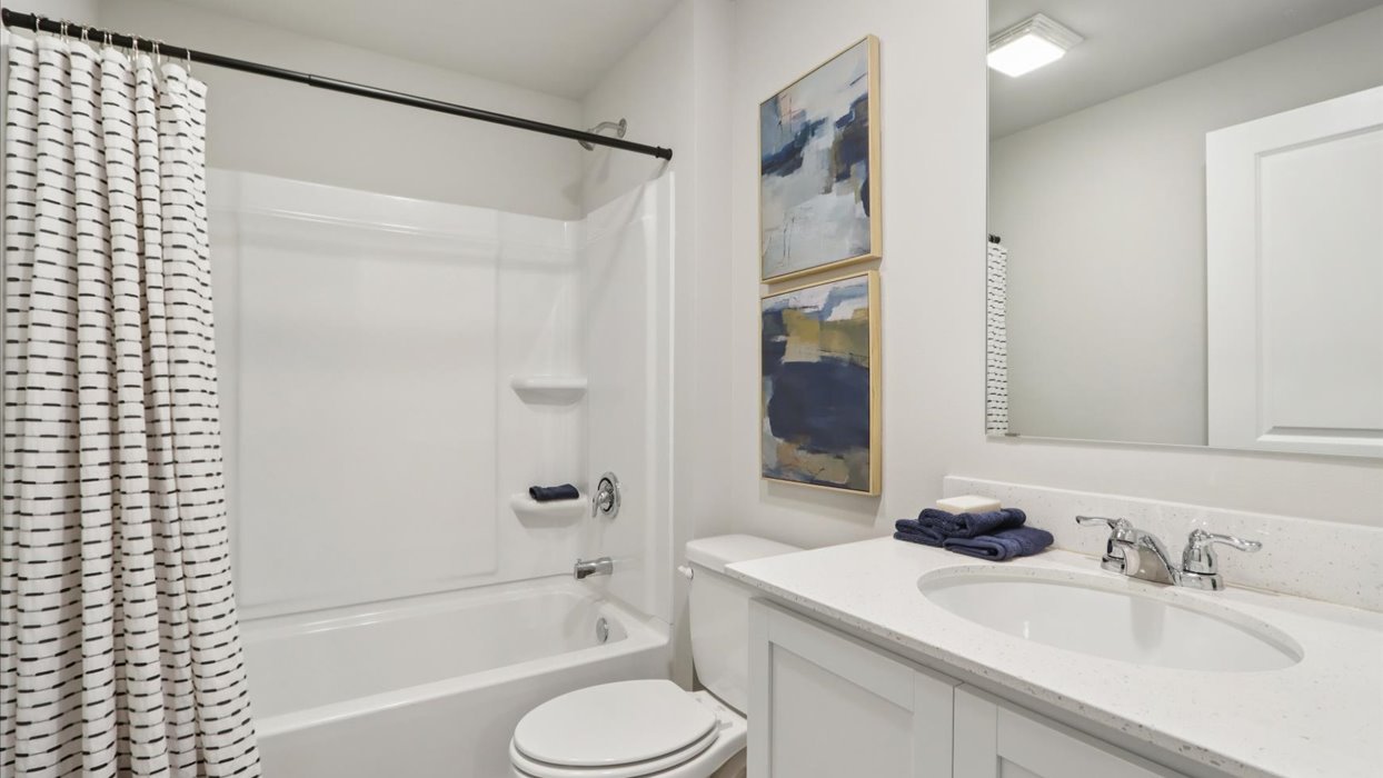 Stylish lower-level bathroom featuring contemporary fixtures and convenient access from the finished basement.