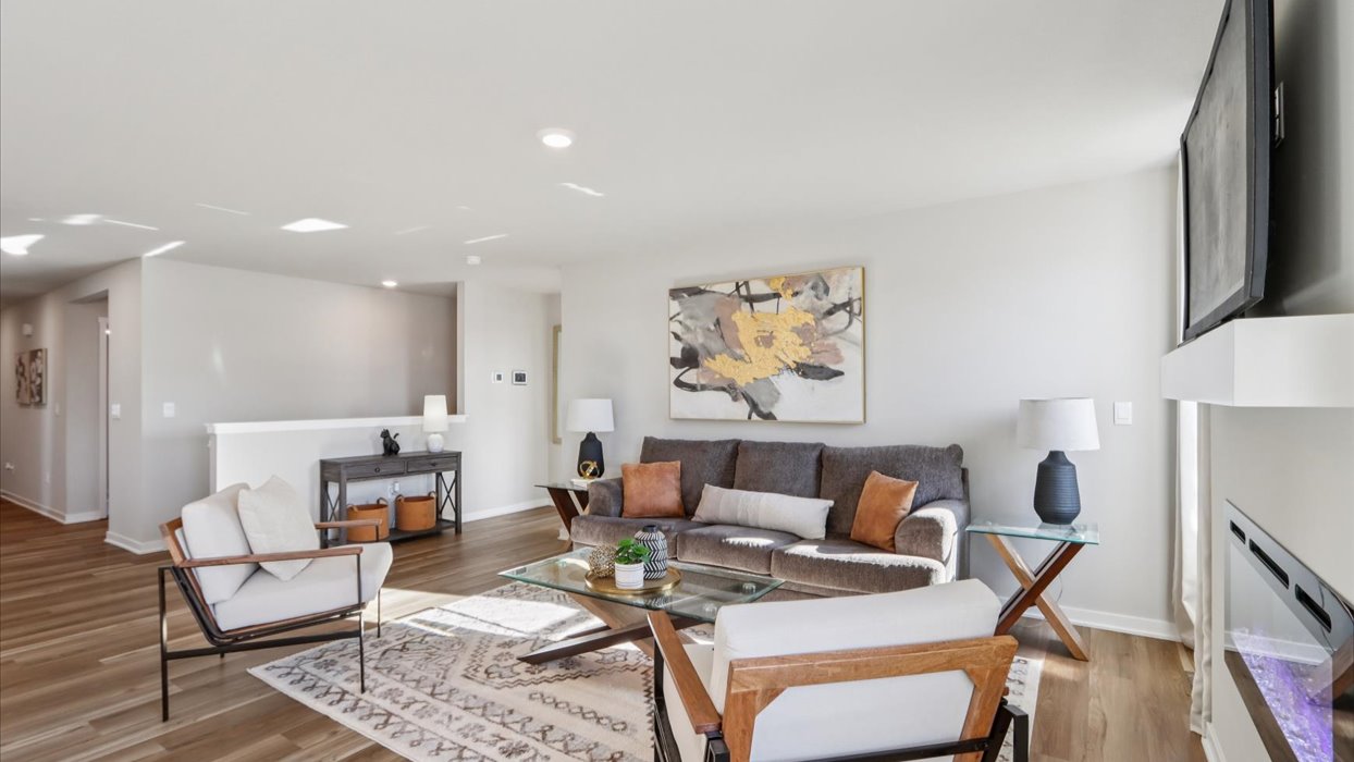 Open concept living room with electric fireplace