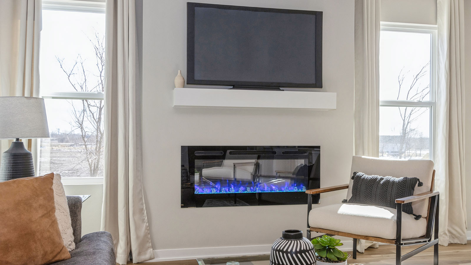 Open concept living room with electric fireplace