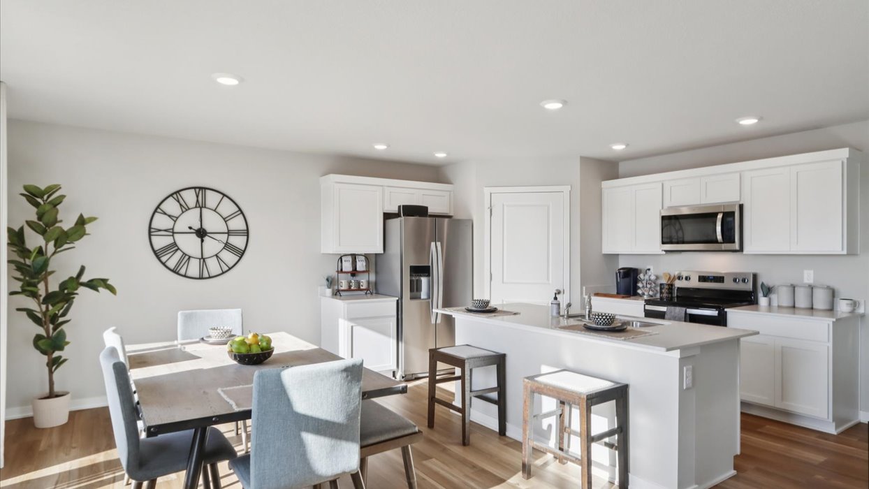 Kitchen with white cabinetry and quartz countertop