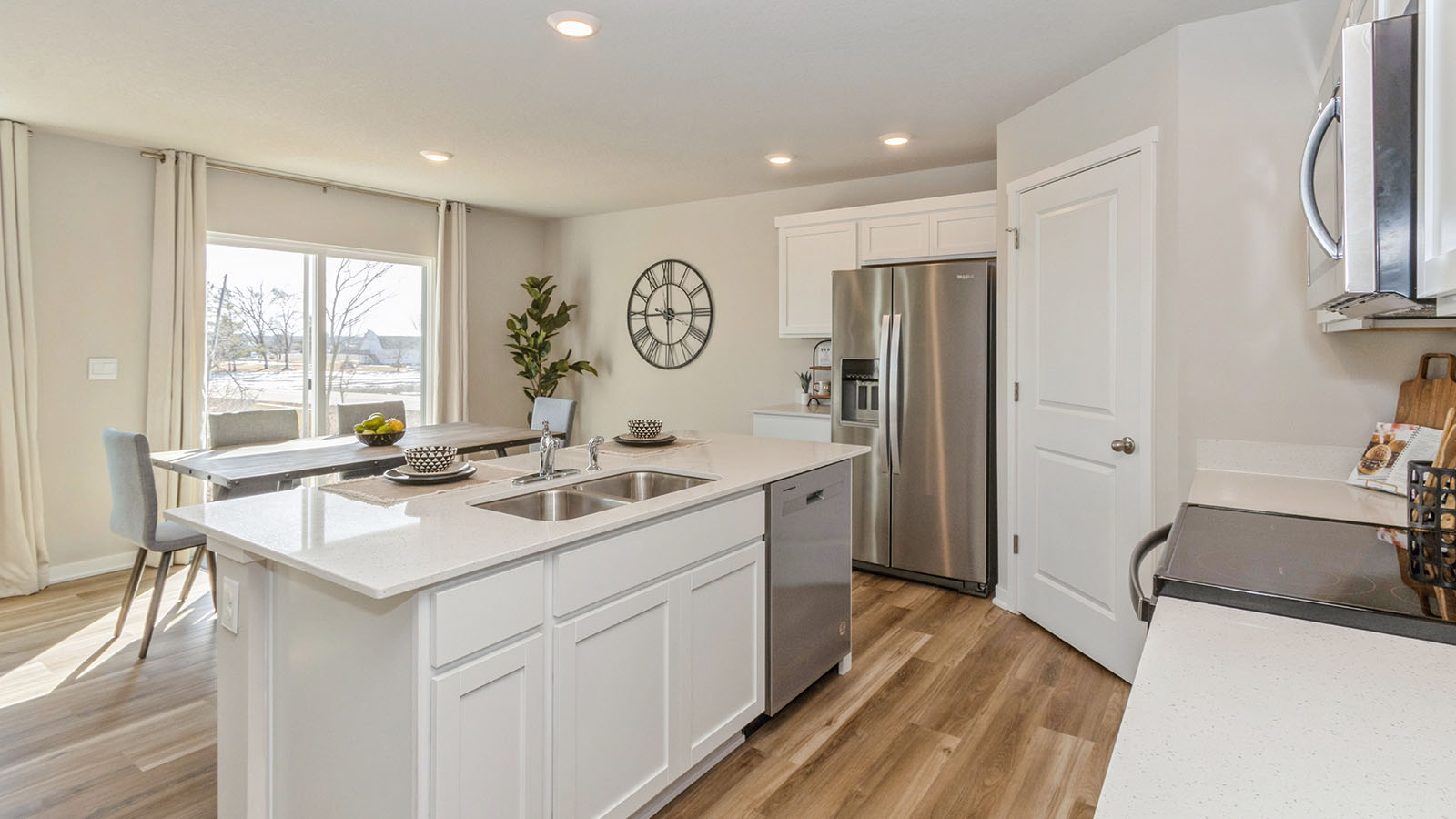 Kitchen with white cabinetry and quartz countertop