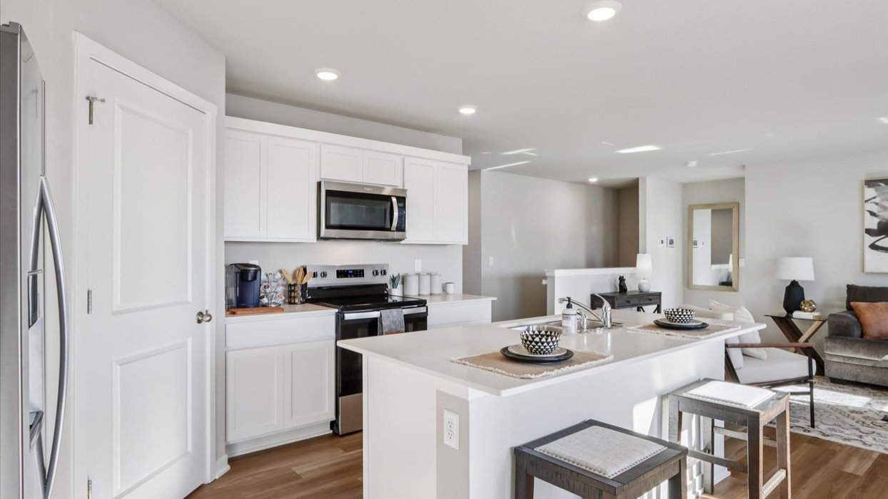 Kitchen with white cabinetry and quartz countertop
