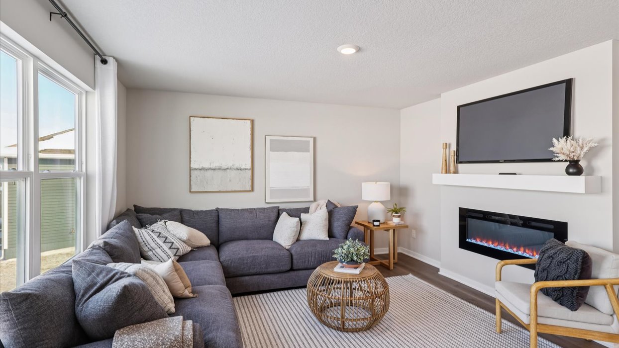 bellhaven living room with mounted tv and electric fireplace