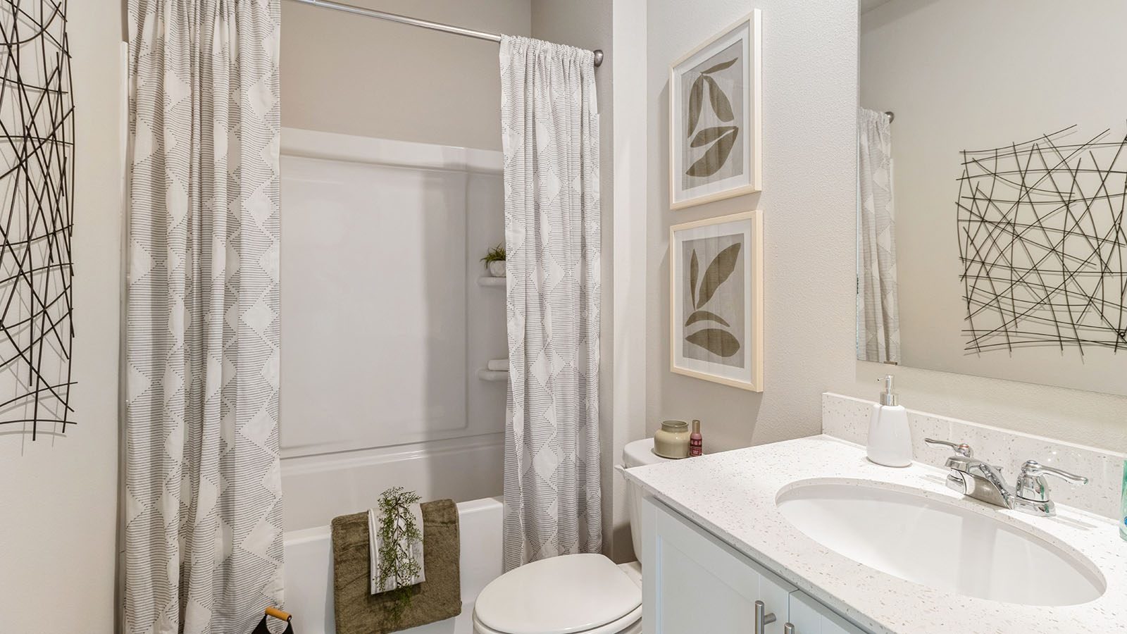 Stylish full bathroom with bright lighting and functional design.