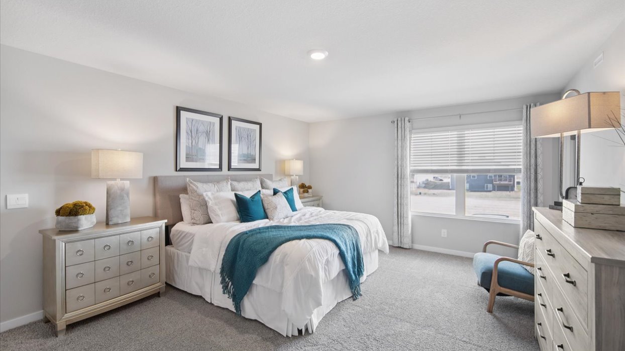 Primary bedroom with natural lighting and spacious layout