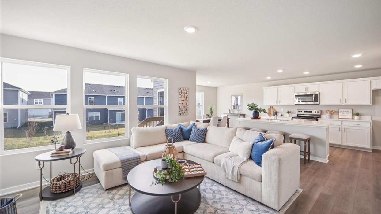 living room overlooking dining area and modern kitchen
