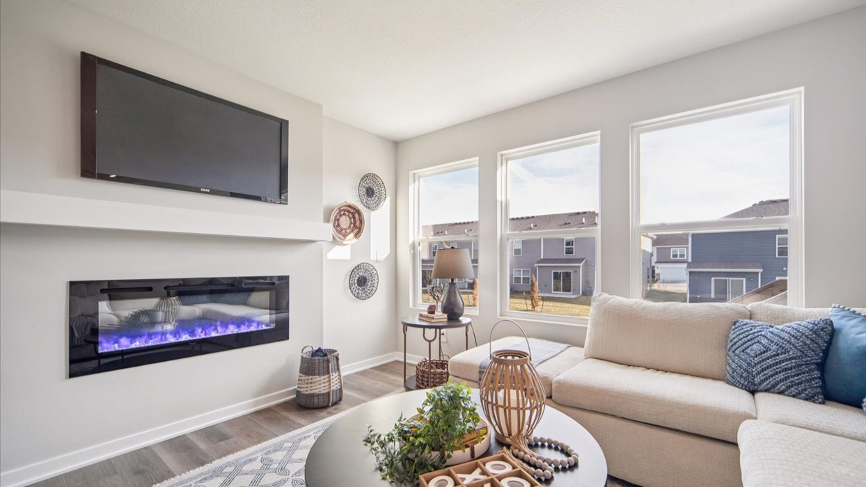 Open concept living room with electric fireplace