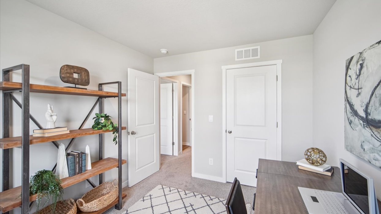 Comfortable secondary bedroom with natural light, modern finishes, and versatile living space.