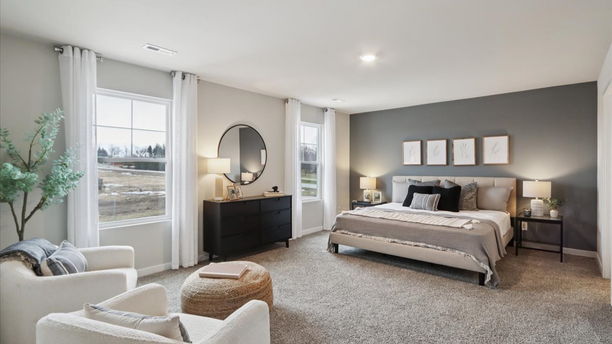 Primary bedroom with natural lighting and spacious layout