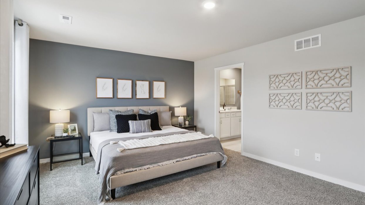 Primary bedroom with natural lighting and spacious layout