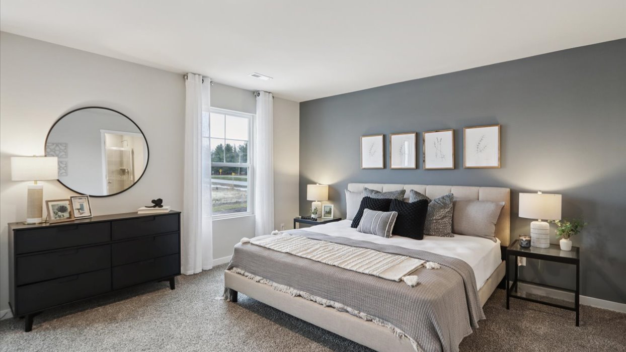 Primary bedroom with natural lighting and spacious layout