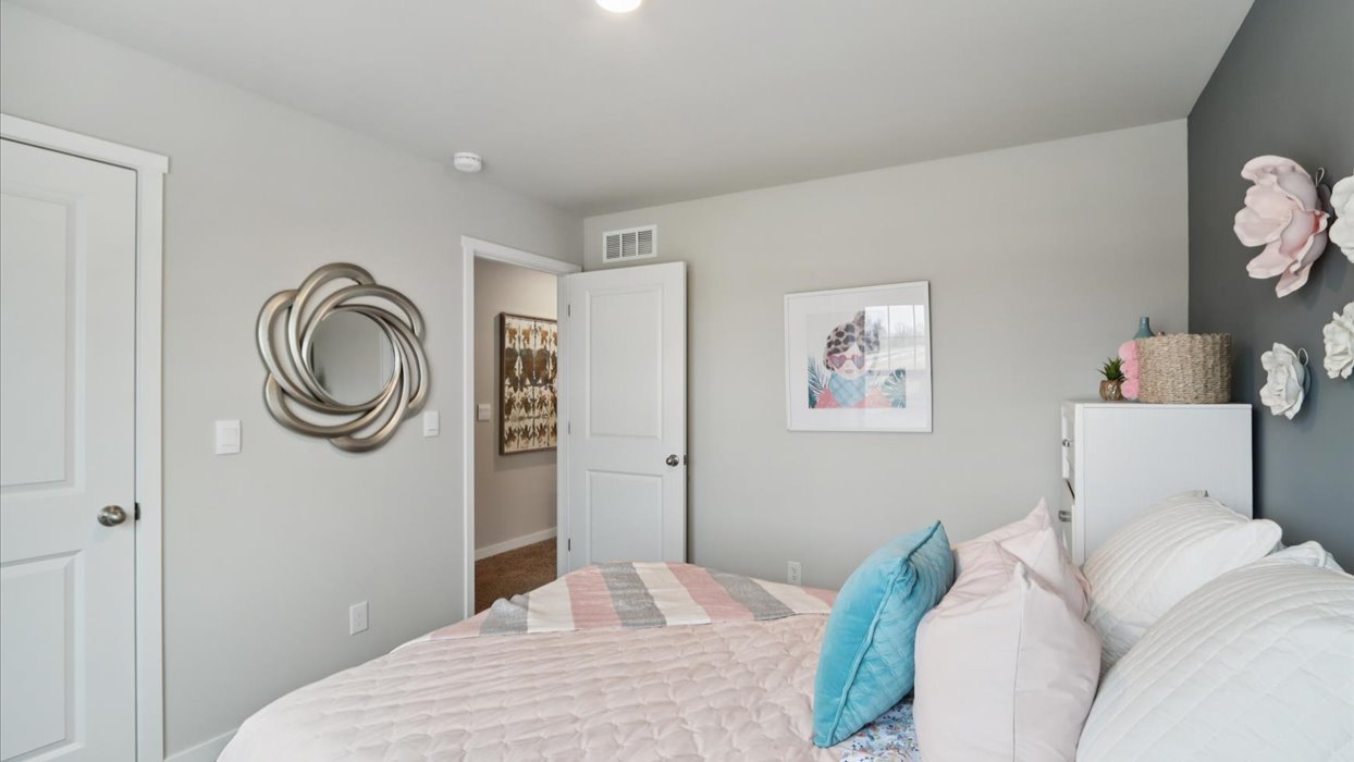 Comfortable secondary bedroom with natural light, modern finishes, and versatile living space.