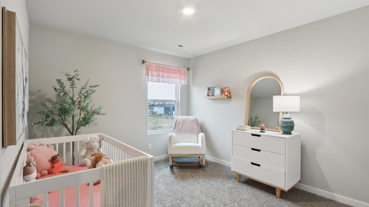 Comfortable secondary bedroom with natural light, modern finishes, and versatile living space.