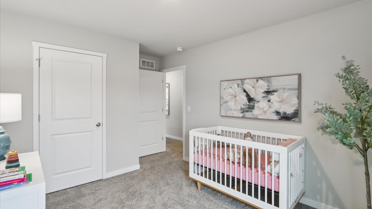 Comfortable secondary bedroom with natural light, modern finishes, and versatile living space.