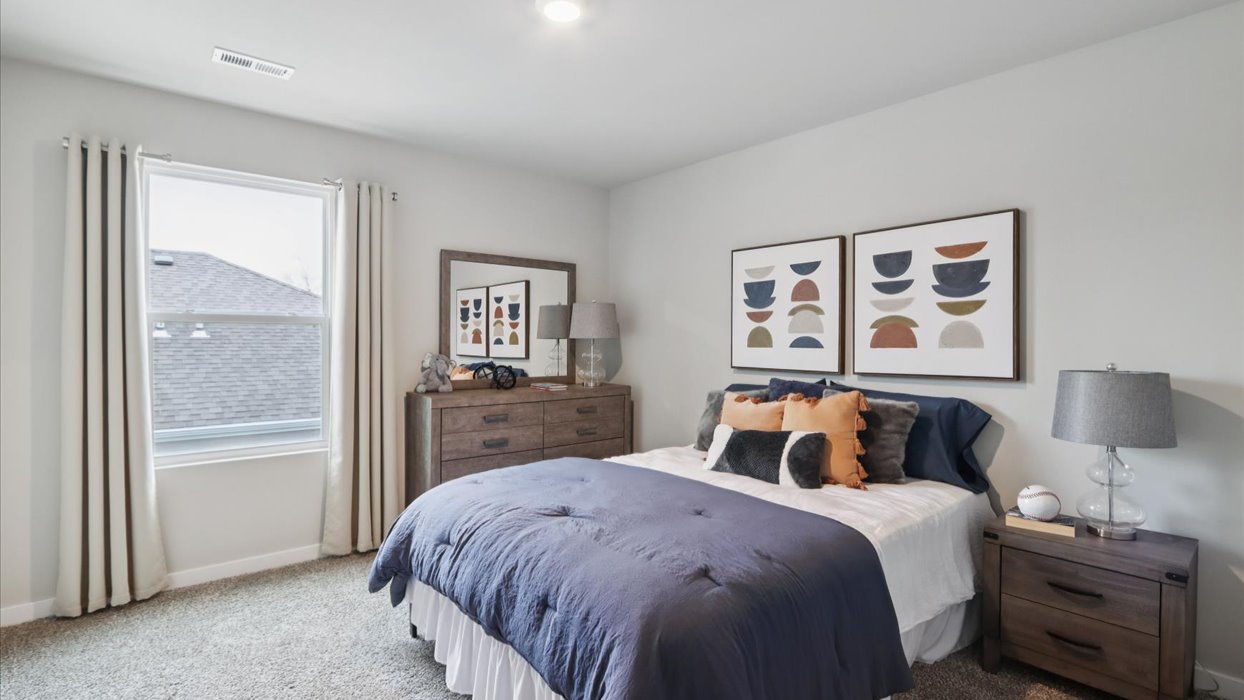Comfortable secondary bedroom with natural light, modern finishes, and versatile living space.