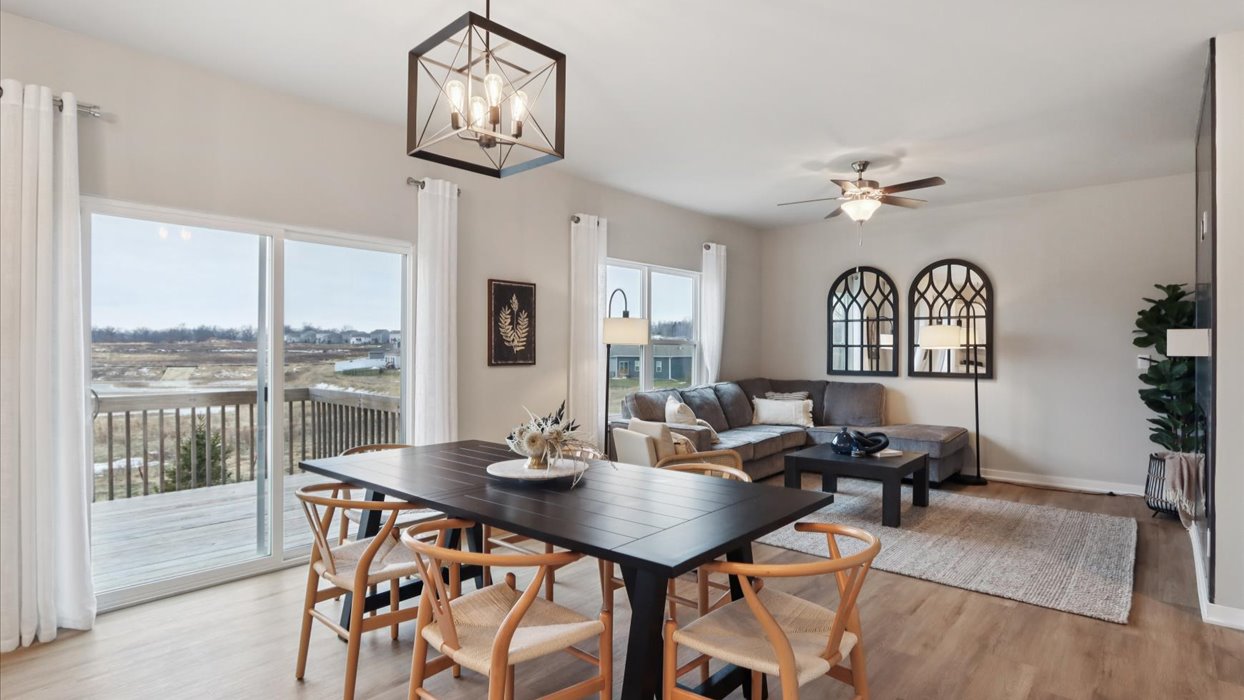 Open concept dining space with access to backyard