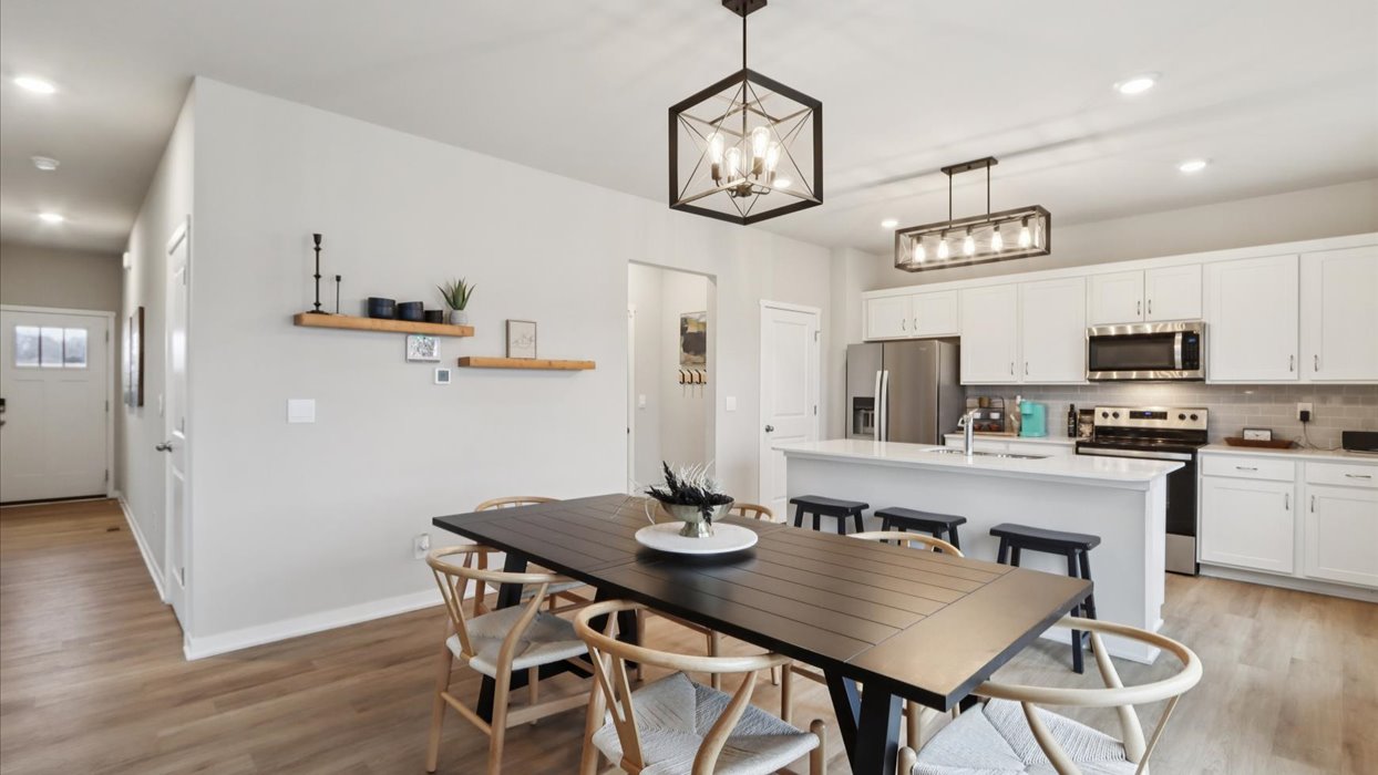 Open concept dining space with access to backyard