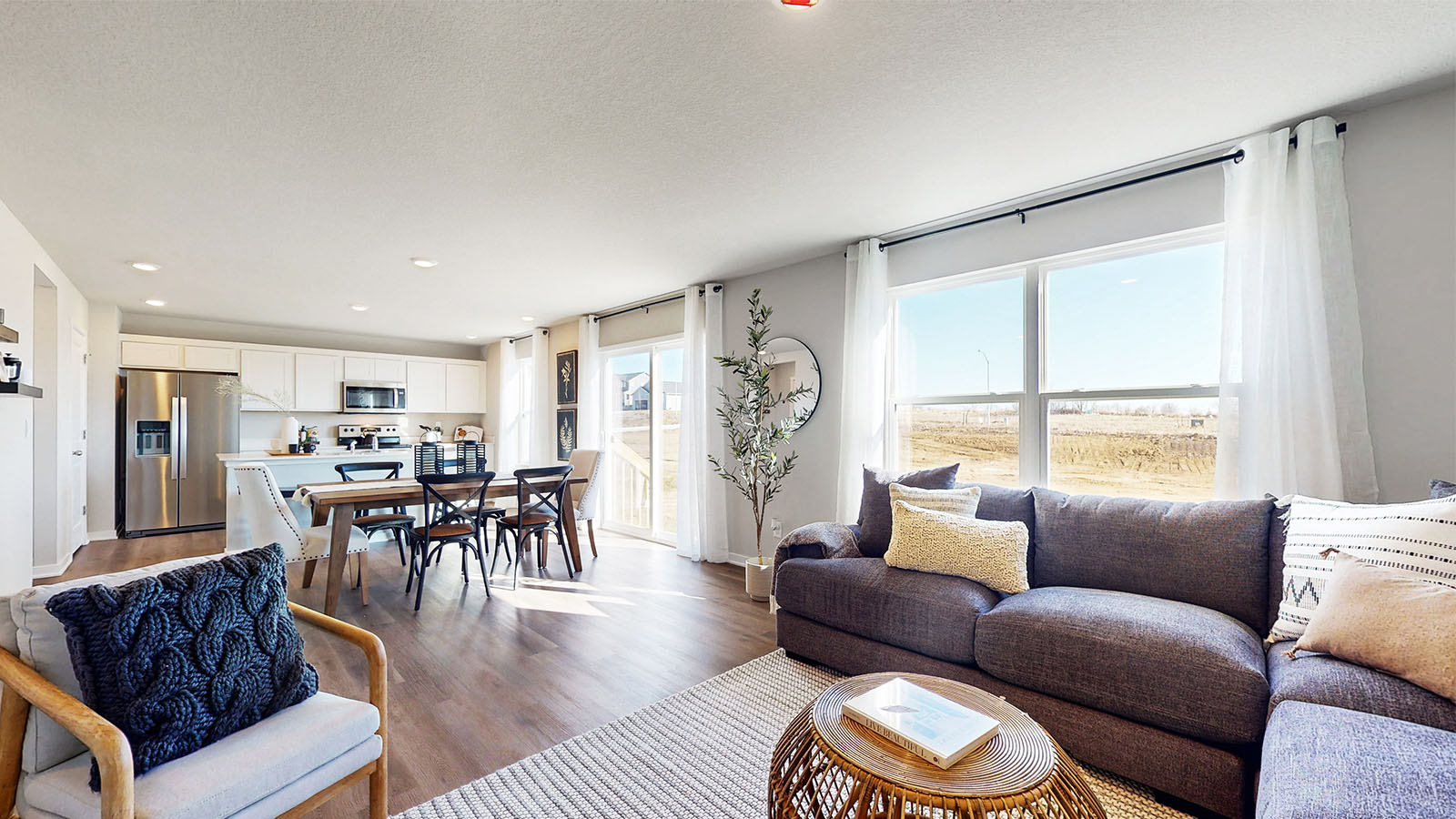 Electric fireplace in the living area highlights your new home, adding stylish open concept connectivity to the main areas