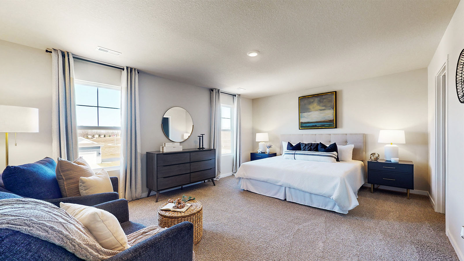 Primary bedroom features ample space, double windows, soft carpet, a stylish walk-in closet, and a private ensuite bath