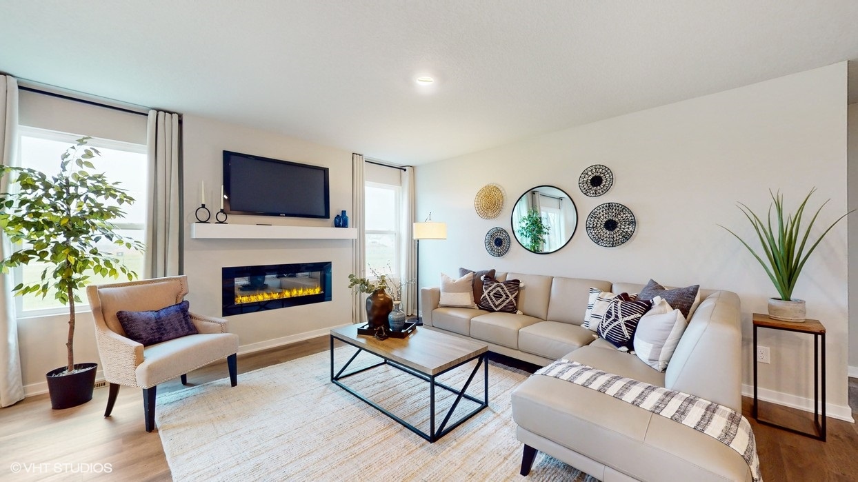 Spacious living room with large tan couch