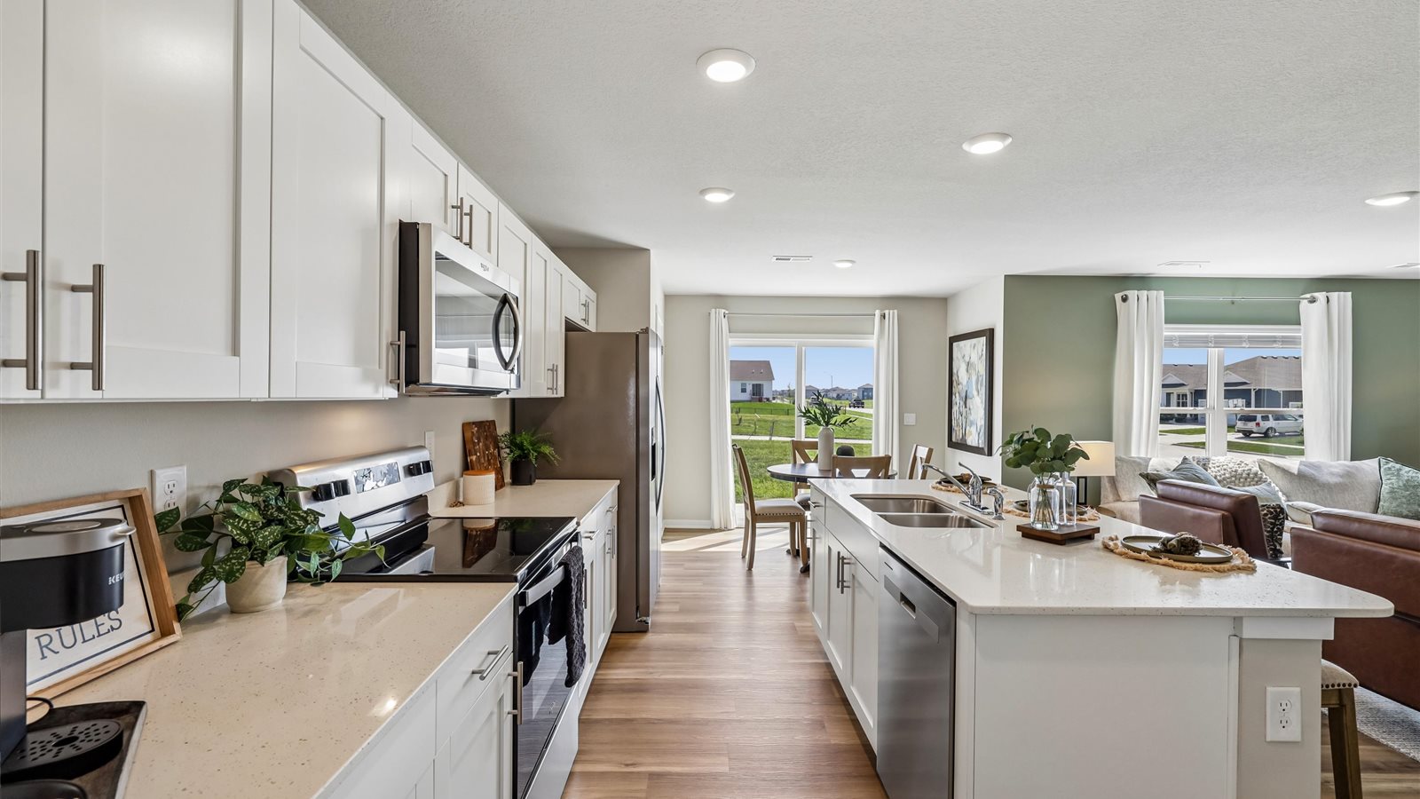 Kitchen with white cabinetry and quartz countertop