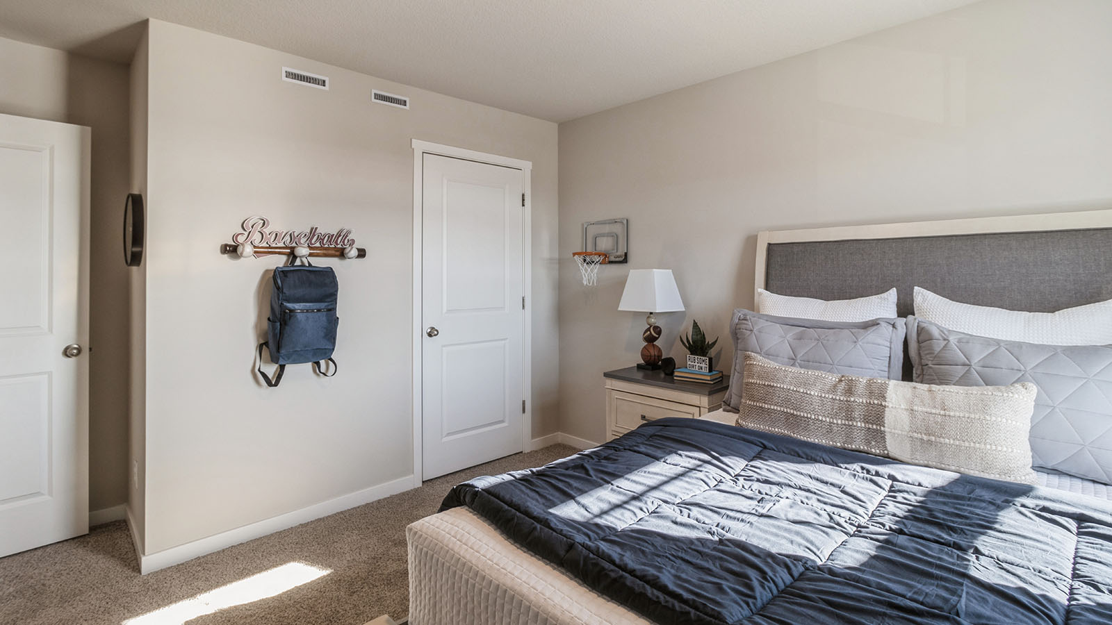 Comfortable secondary bedroom with natural light, modern finishes, and versatile living space.