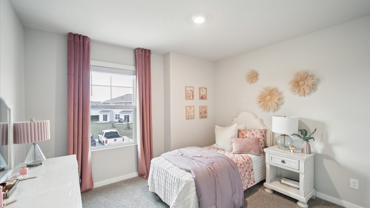 Comfortable secondary bedroom with natural light, modern finishes, and versatile living space.