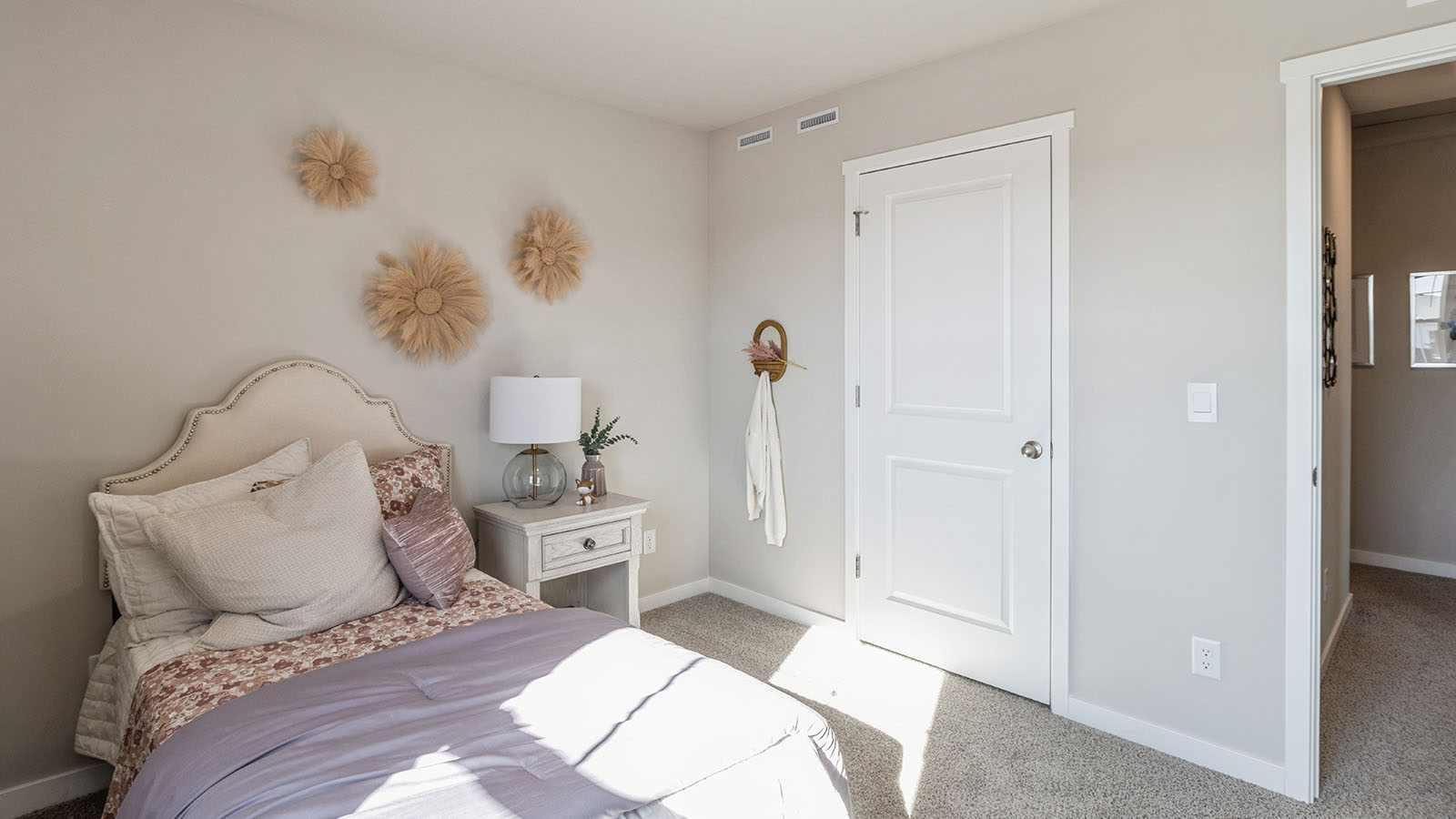 Comfortable secondary bedroom with natural light, modern finishes, and versatile living space.