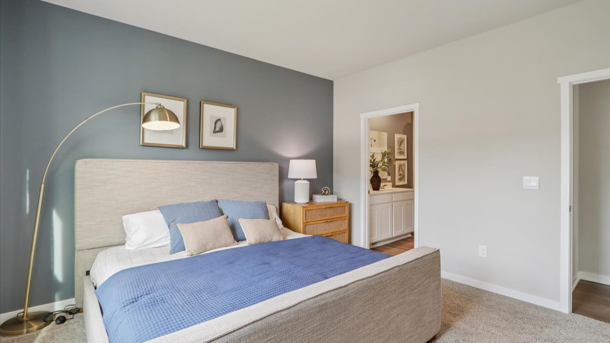 Primary bedroom with natural lighting and spacious layout