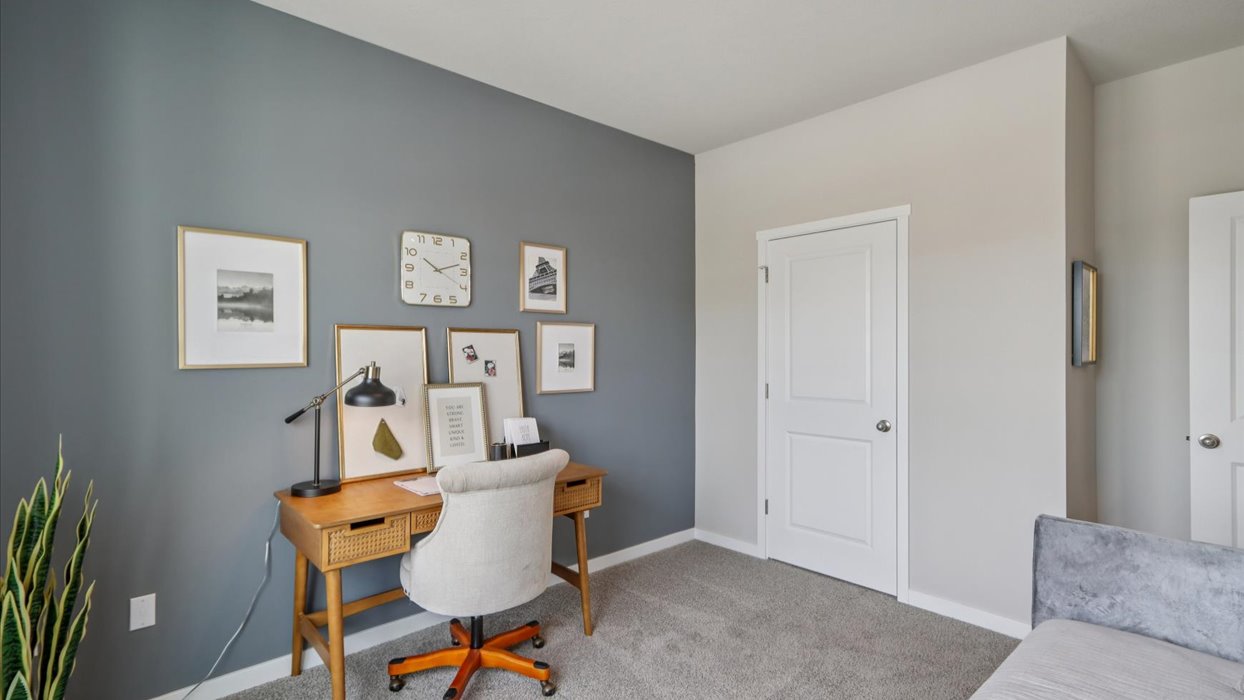 Comfortable secondary bedroom with natural light, modern finishes, and versatile living space.