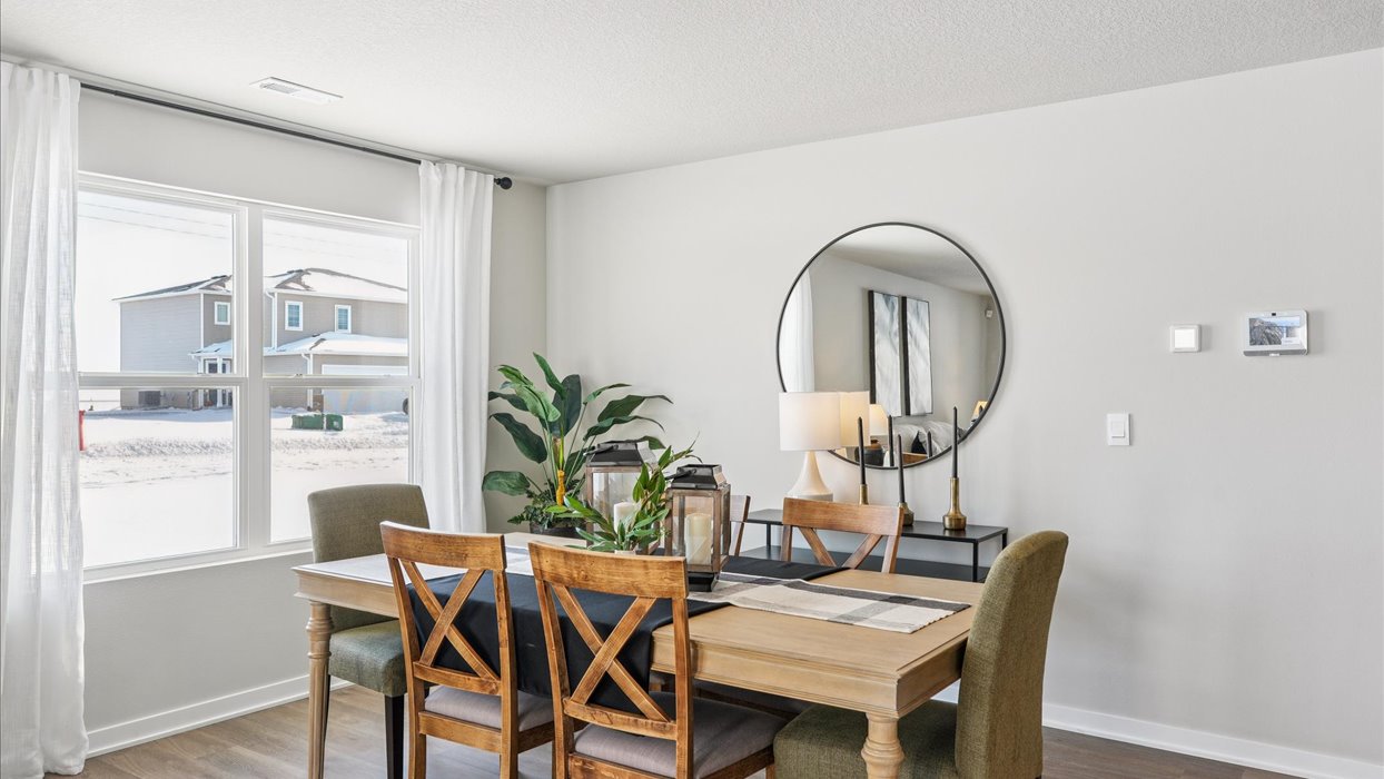 dining room with wood table and large window