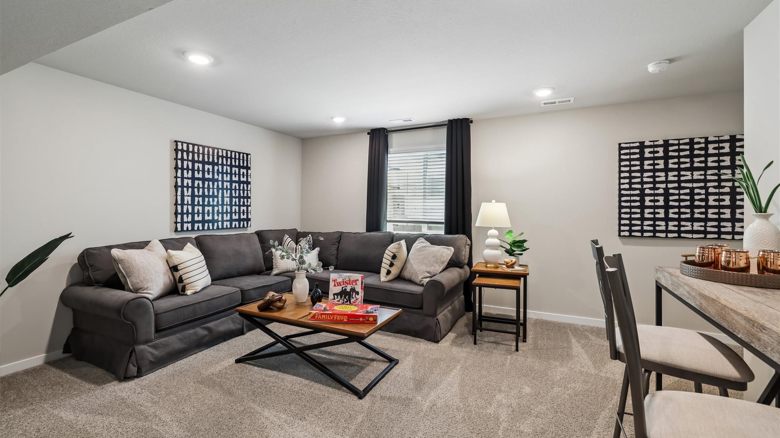 Finished basement living area with comfortable seating space and flexible room for entertaining or relaxing.