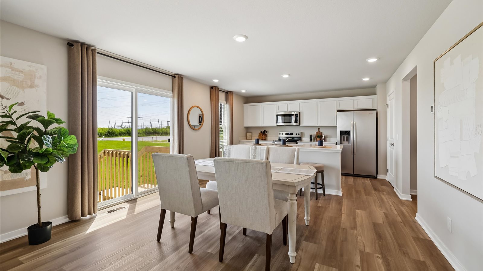 Open concept dining space with access to backyard