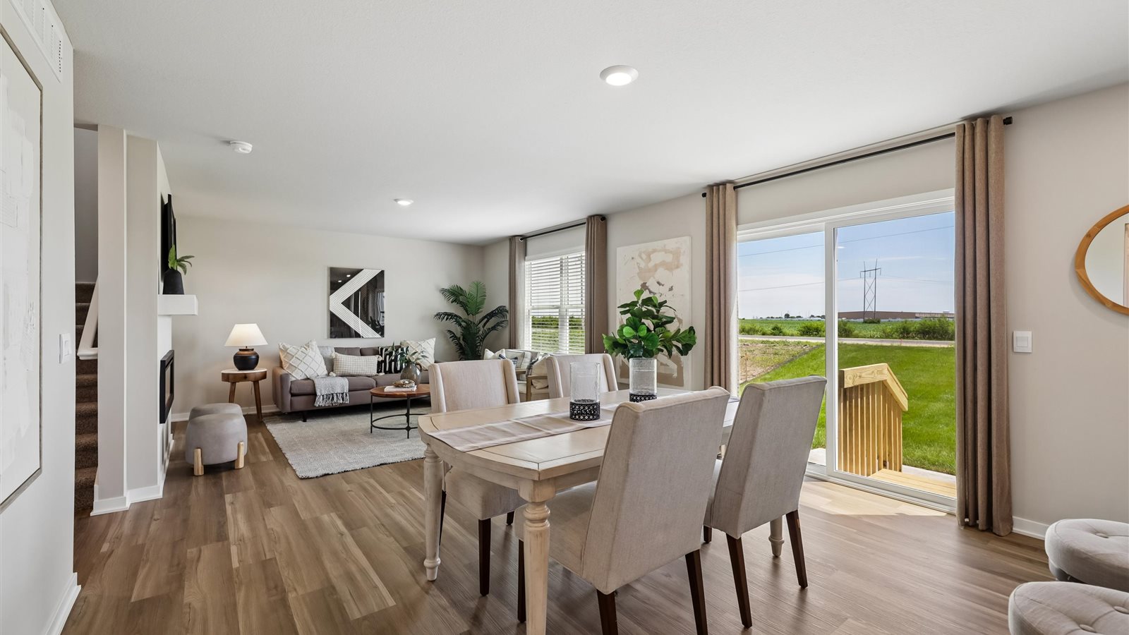 Open concept dining space with access to backyard
