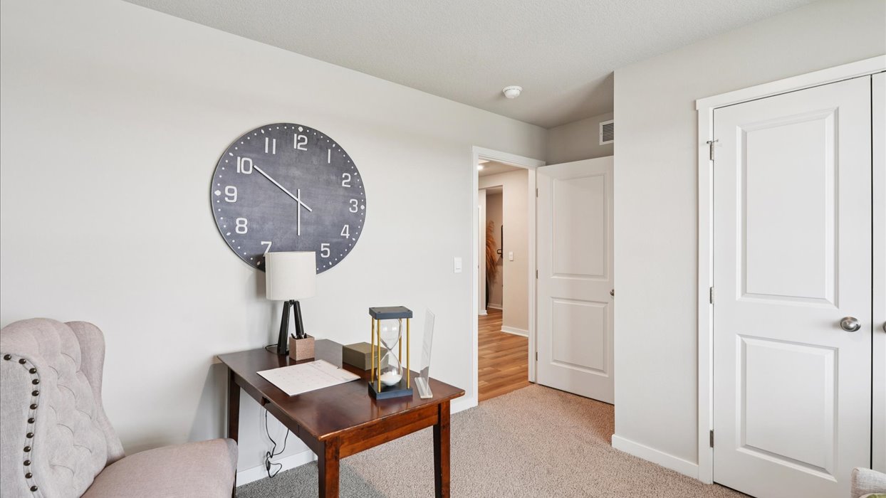 Comfortable secondary bedroom with natural light, modern finishes, and versatile living space.