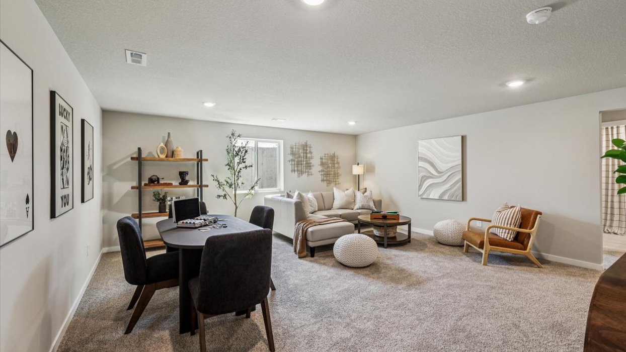 Finished basement living area with comfortable seating space and flexible room for entertaining or relaxing.