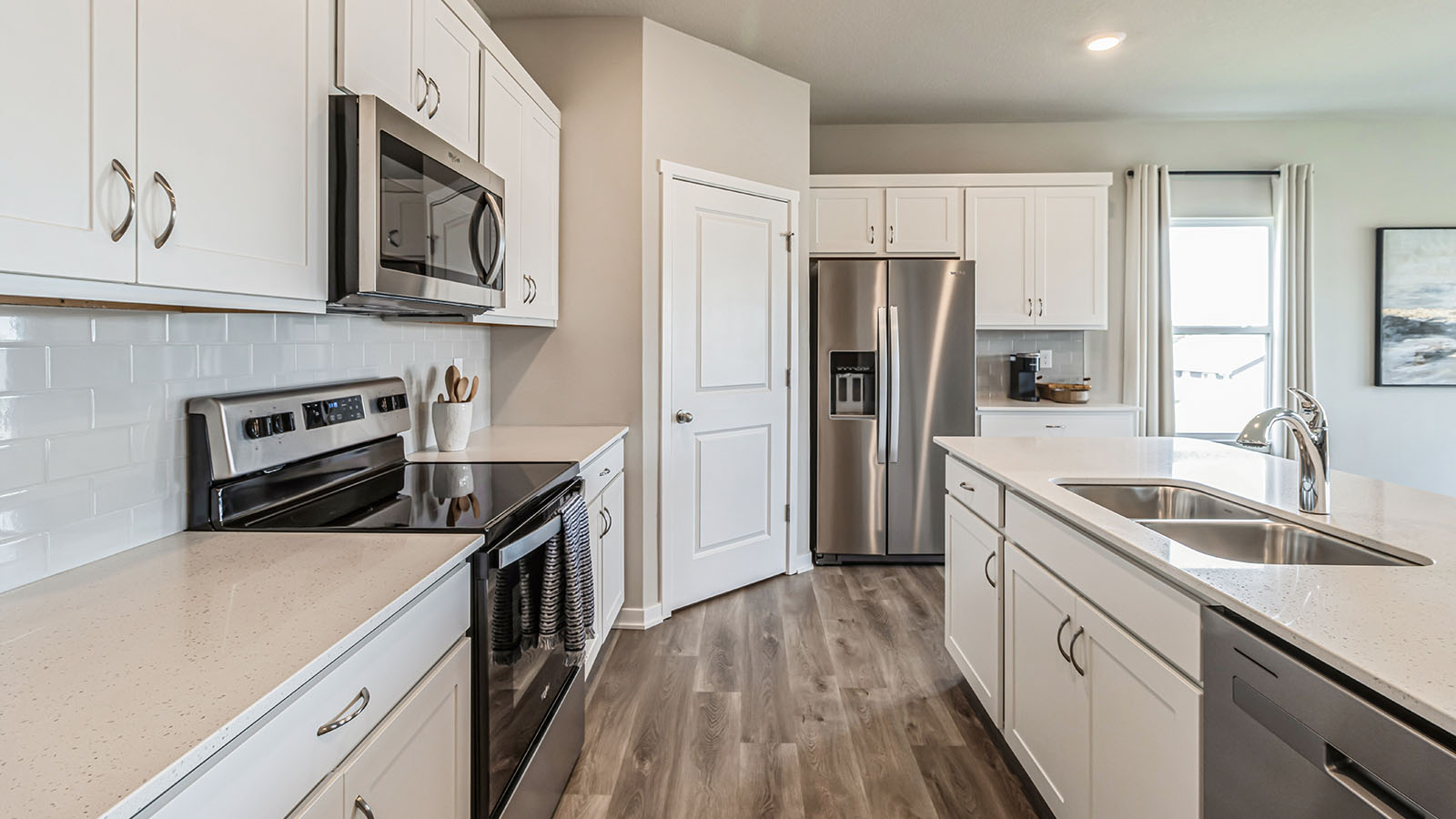 Kitchen with white cabinetry and quartz countertop