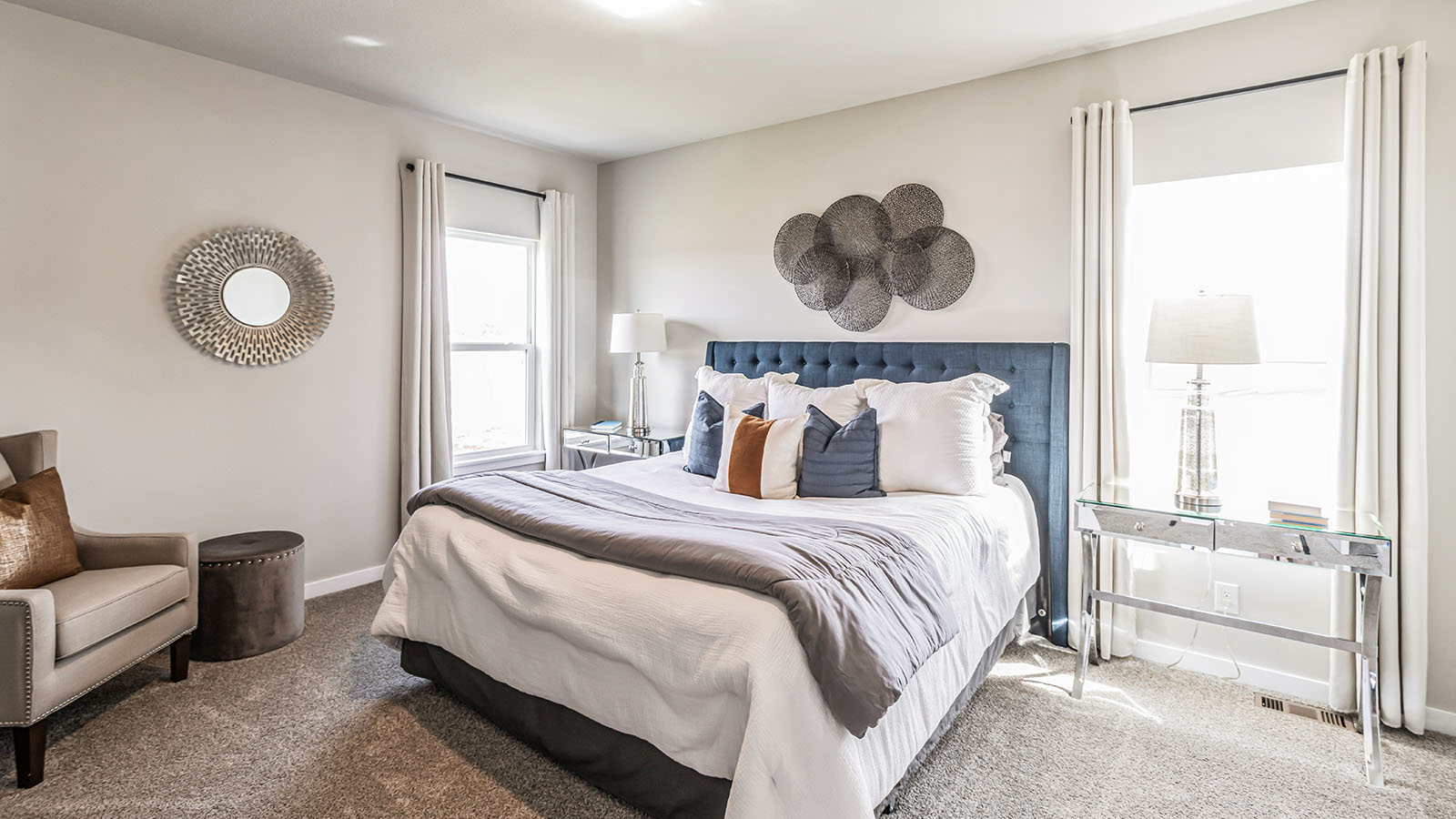 Primary bedroom with natural lighting and spacious layout
