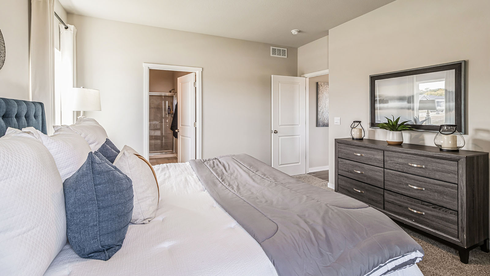 Primary bedroom with natural lighting and spacious layout