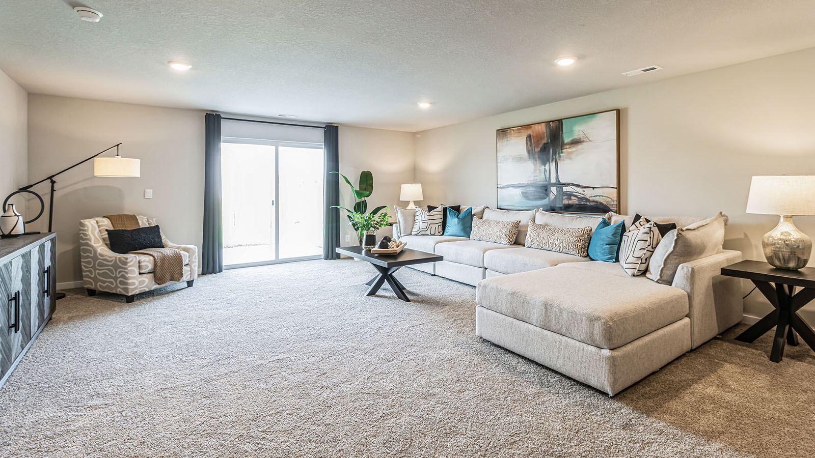 Finished basement living area with comfortable seating space and flexible room for entertaining or relaxing.