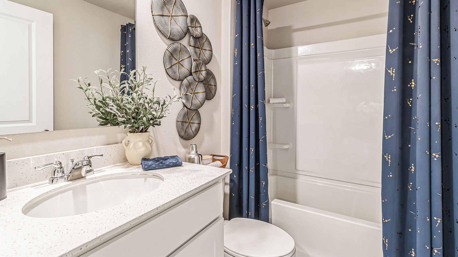 Stylish lower-level bathroom featuring contemporary fixtures and convenient access from the finished basement.